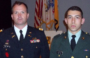 Capt. Anslem Richards, USA (l), professor of military science at the University of Rhode Island, congratulates Cadet Luke McCabe as he receives the chapter's Honor Award in April.